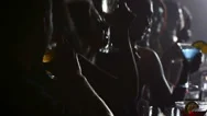 Dark Shot Of A Row Of People Drinking At A Bar Stock Footage