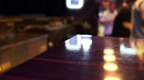 Dark shot of a row of people drinking at a bar Stock Footage 62237212