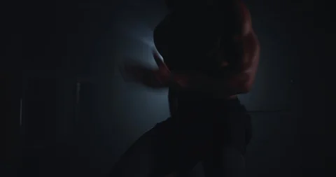 In the dark side of a gym class athletic strong guy doing a cross fit exercises Stock Footage 118607920