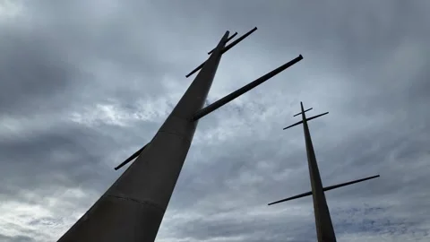 Dark silhouettes abstract cross structure moody sky Vídeos de archivo 317442518