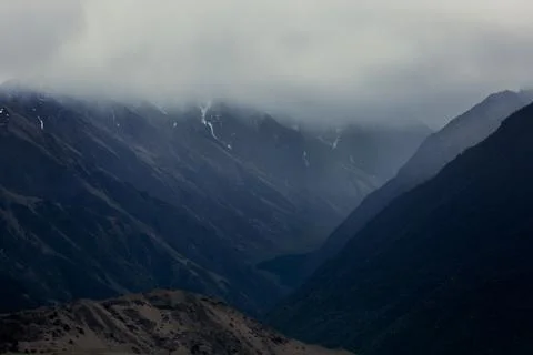 Dark silhouettes of mountains Stock Photos