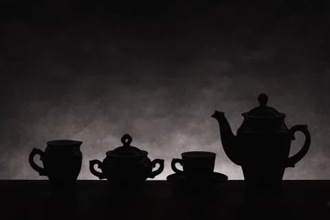 Dark silhouettes of ware for coffee on a gradient background Stock Photos