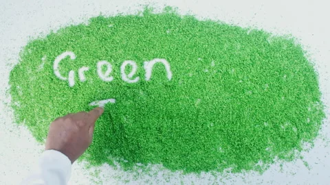 Dark skin man's hand writing in green sand words Green ideas Stock Footage 248637377
