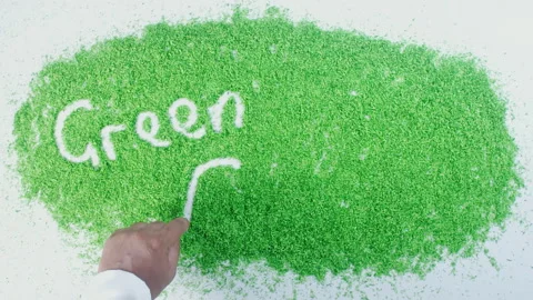 Dark skin man's hand writing in green sand words Green fields Stock Footage 248638287
