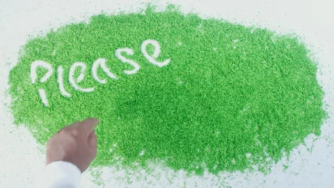 Dark skin man's hand writing in green sand words Recycle Stock Footage 248641470