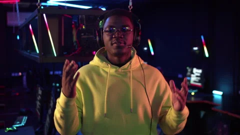 A dark-skinned commentator of esports matches leads a live broadcast from the Stock Footage 151495355
