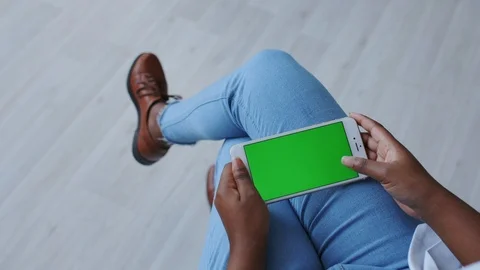 Dark Skinned Female Hands with Tracking Green Screen or Chromakey. Using Stock Footage 121094957