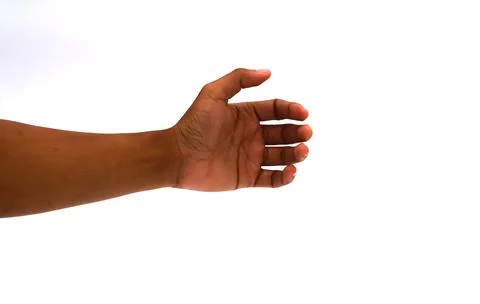 Dark-skinned hand gesture on white background, ready to hold or present som.. Stock Photos