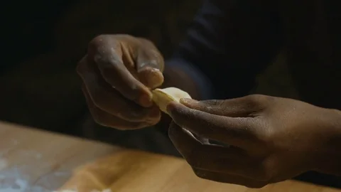 Dark-skinned hand mold dumplings Stock Footage 83852960