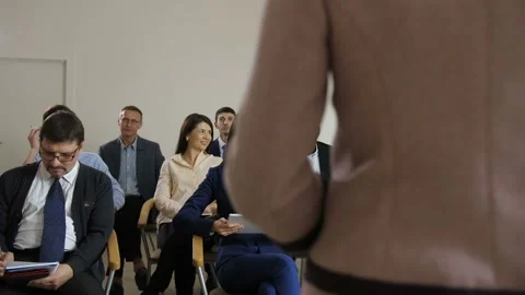 Dark-skinned man asking a question at training Video stock 108010101