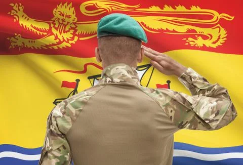 Dark-skinned soldier in hat facing Canadian province flag series - New Brunsw 写真素材