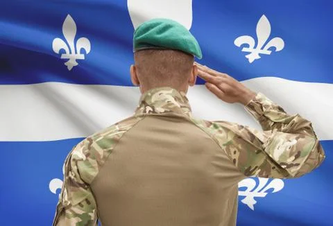 Dark-skinned soldier in hat facing Canadian province flag series - Quebec 스톡 사진