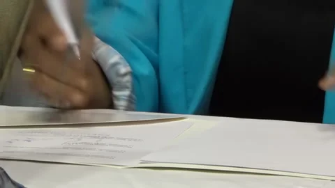 Dark skinned woman hand preparing papers. 22.03.2024 Baku, Azerbaijan Stock Footage 283789634