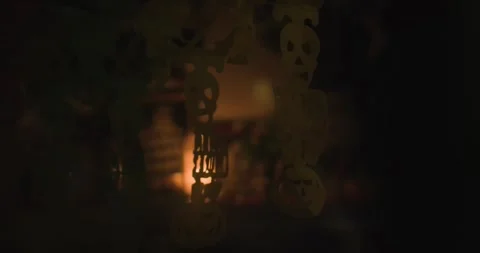 Dark skull decor in grave in front of candle for Dia de los Muertos Stock Footage 316719502