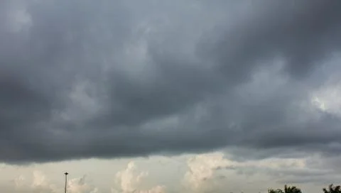 Dark sky and dramatic black cloud before rain. Stock Photos
