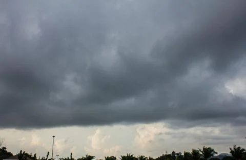 Dark sky and dramatic black cloud before rain. Stock Photos