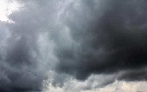 Dark sky and dramatic black cloud before rain. Stock Photos