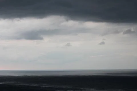 Dark sky and dramatic black cloud before rain. Stock Photos