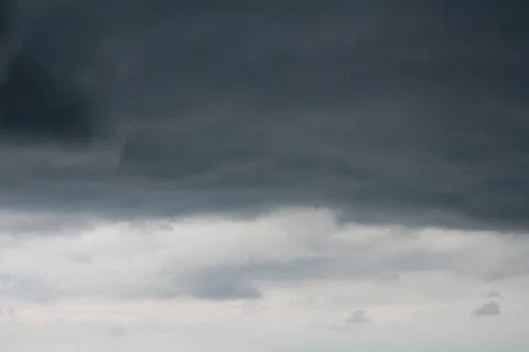 Dark sky and dramatic black cloud before rain. Stock Photos