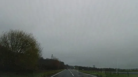 Dark Sky and Rain Clouds During Drive over England GB Stock Footage 323216868