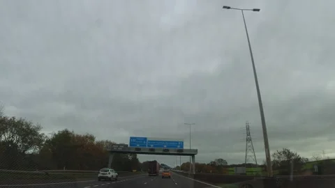 Dark Sky and Rain Clouds During Drive over England GB Stock Footage 323272158