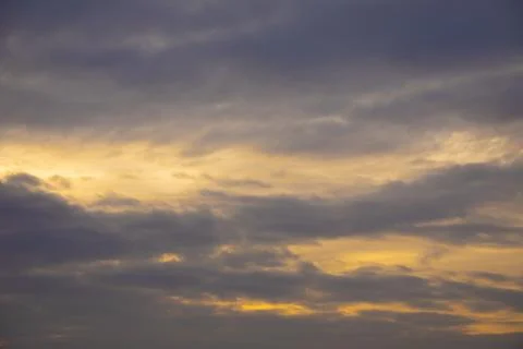 Dark sky background with dramatic thunder clouds and sunlight, sky background Stock Photos