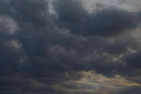 Dark sky with clearings, dramatic sky horizon, sky before the storm, impendin Stock Photos