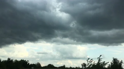 Dark sky with clouds over the lake. A storm is coming Stock Footage 135626837