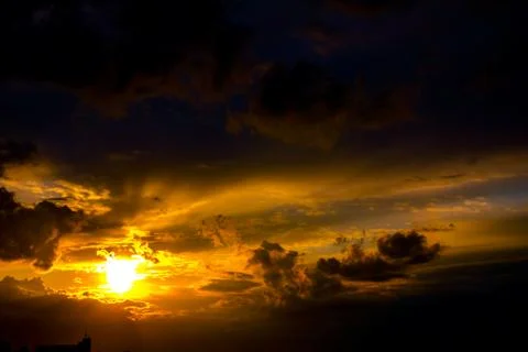 Dark sky with clouds at sunset Stock Photos