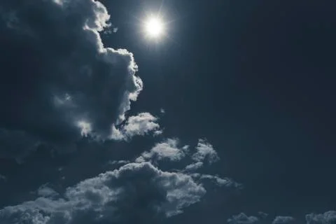 Dark sky with cloudscape and sun for backgrounds Stock Photos