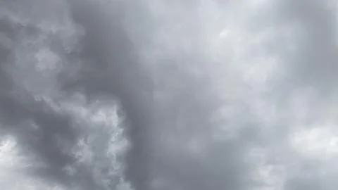 The dark sky with heavy clouds converging Stock Photos