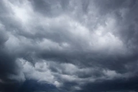 The dark sky with heavy clouds converging and a violent storm before the ra.. Stock Photos