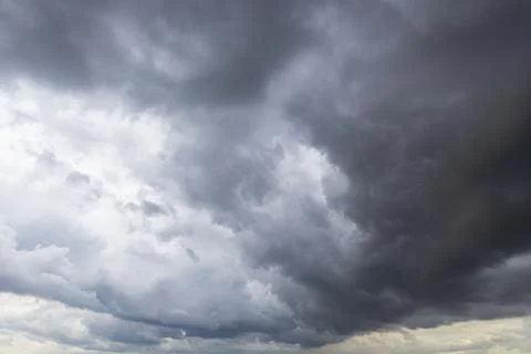 The dark sky with heavy clouds converging and a violent storm before the ra.. Stock Photos