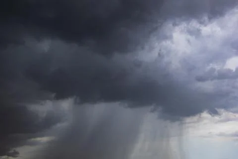 The dark sky with heavy clouds converging and a violent storm before the ra.. Stock Photos