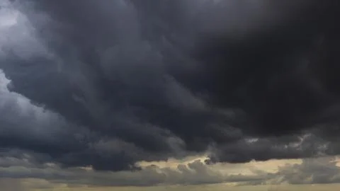 The dark sky with heavy clouds converging and a violent storm before the ra.. Stock Photos