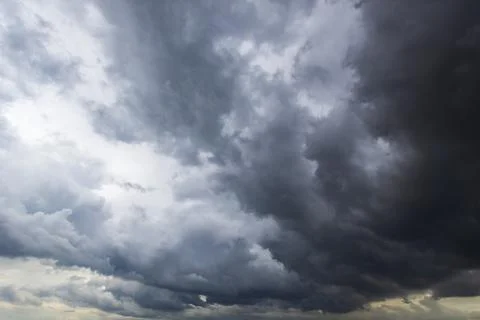The dark sky with heavy clouds converging and a violent storm before the ra.. Stock Photos