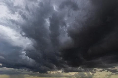 The dark sky with heavy clouds converging and a violent storm before the ra.. Stock Photos