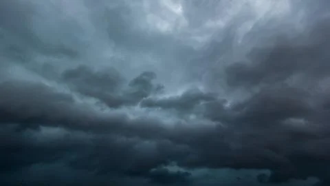 The dark sky with heavy clouds converging and a violent storm before the ra.. Stock Photos
