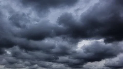 The dark sky with heavy clouds converging and a violent storm before the ra.. Stock Photos