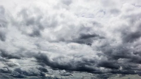 The dark sky with heavy clouds converging and a violent storm before the ra.. Stock Photos