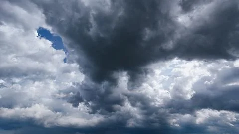 The dark sky with heavy clouds converging and a violent storm before the ra.. Stock Photos