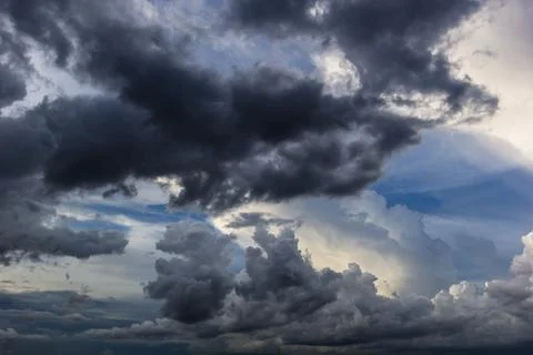 The dark sky with heavy clouds converging and a violent storm before the ra.. Stock Photos