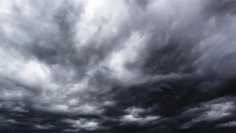 The dark sky with heavy clouds converging and a violent storm before the ra.. Stock Photos
