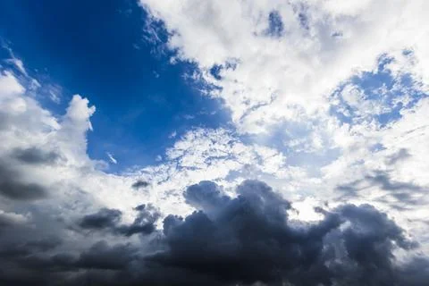 The dark sky with heavy clouds converging and a violent storm before the ra.. Stock Photos