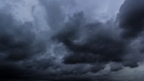 The dark sky with heavy clouds converging and a violent storm before the ra.. Stock Photos