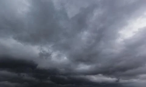 The dark sky with heavy clouds converging and a violent storm before the ra.. Stock Photos