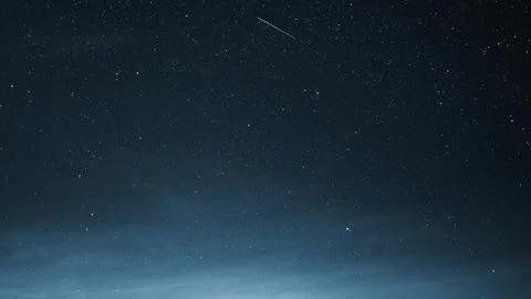 Dark sky night celestial shooting star background Foto stock
