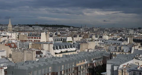 Dark sky over the traditional rooftops of the 10th arrondissement, Paris, France Stock Footage 315317302