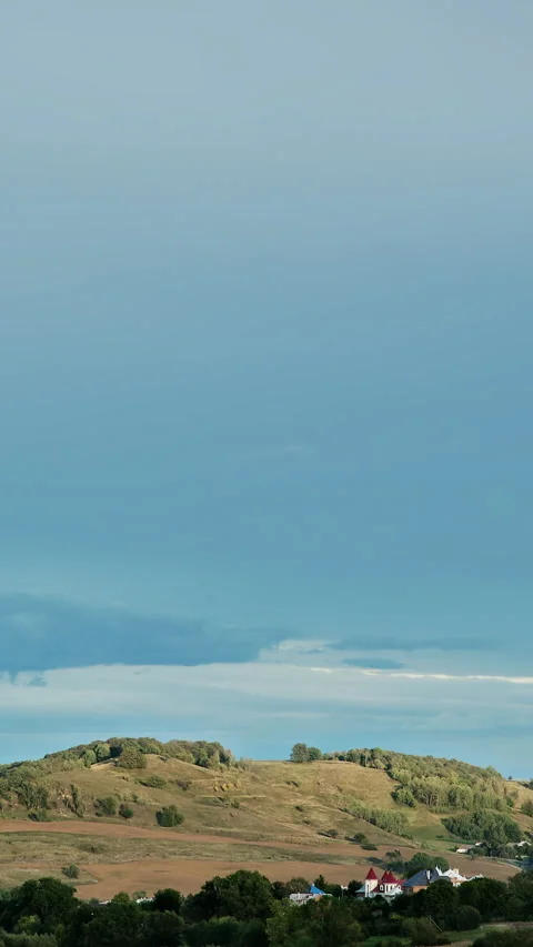 The dark sky over the village. Vertical  Time lapse Stock Footage 235609284