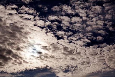 Dark sky with small white clouds Stock Photos